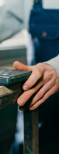 Man in a workshop holding a keyboard