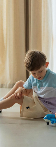 Child playing with a toy plane