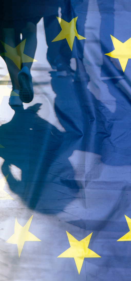 EU flag and people walking 