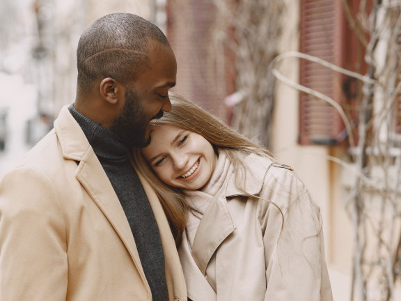 A couple, smiling. 