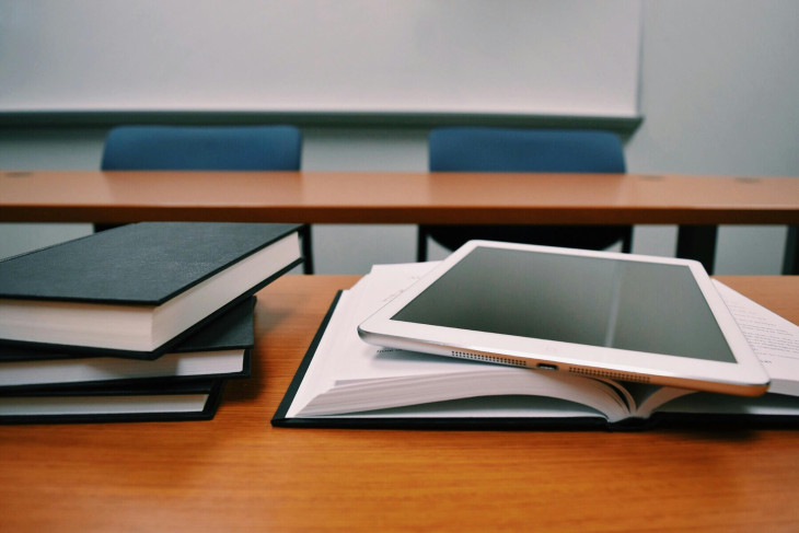Tablet and books on desk