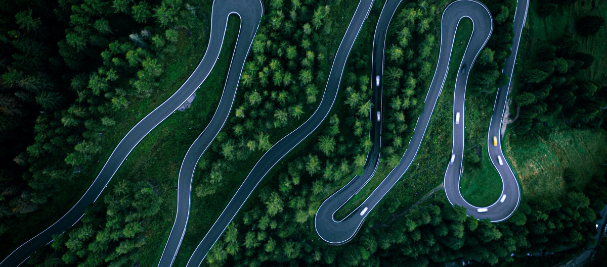 Winding road in a forest area, seen from above